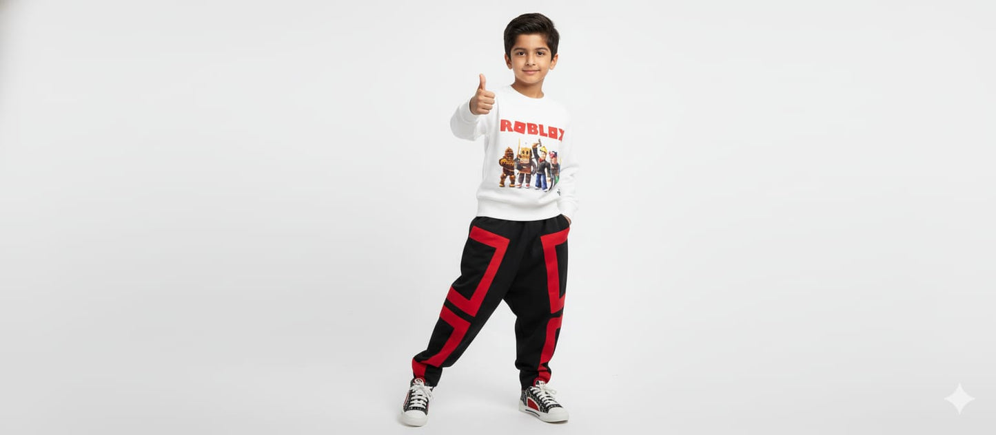 Child wearing a white sweatshirt with graphics and black pants with red accents on a white background