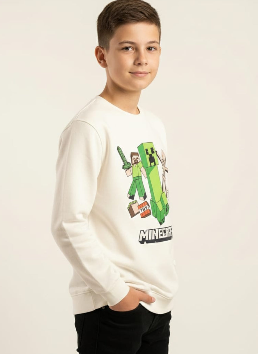 Child wearing a white long-sleeve shirt with Minecraft character design on a beige background