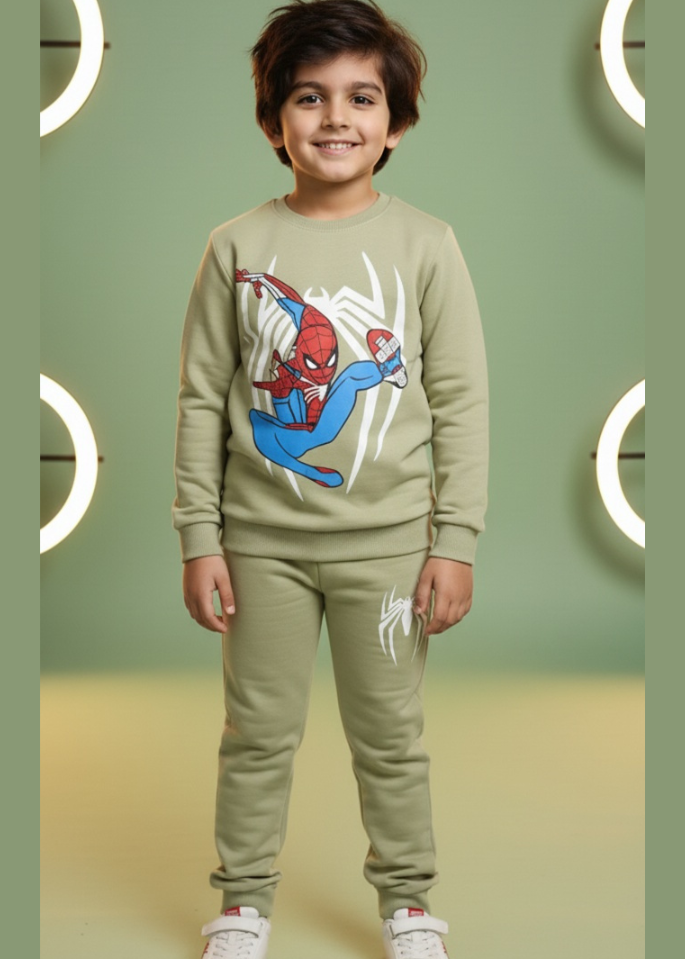 Child wearing a Spider-Man themed sweatshirt and pants on a green background