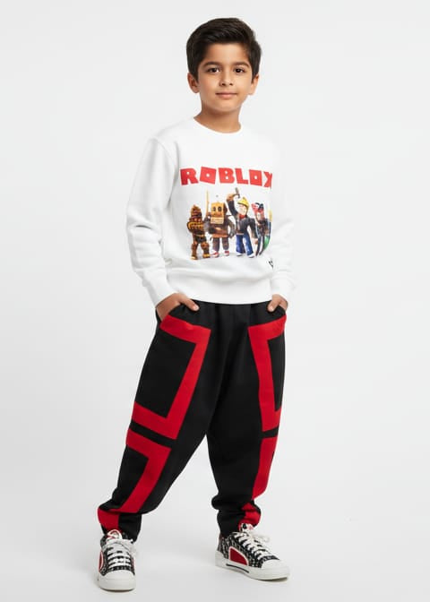 Child wearing a white sweatshirt with graphics and red and black pants on a white background