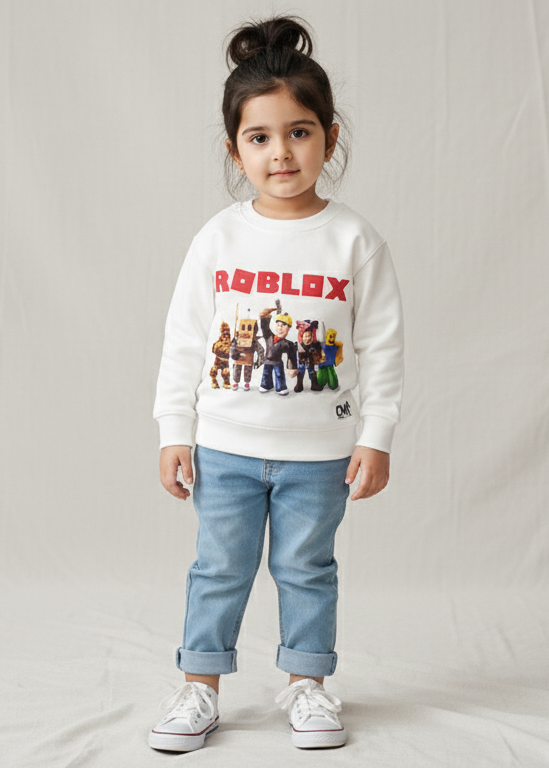 Child wearing a Roblox sweatshirt and jeans on a plain background