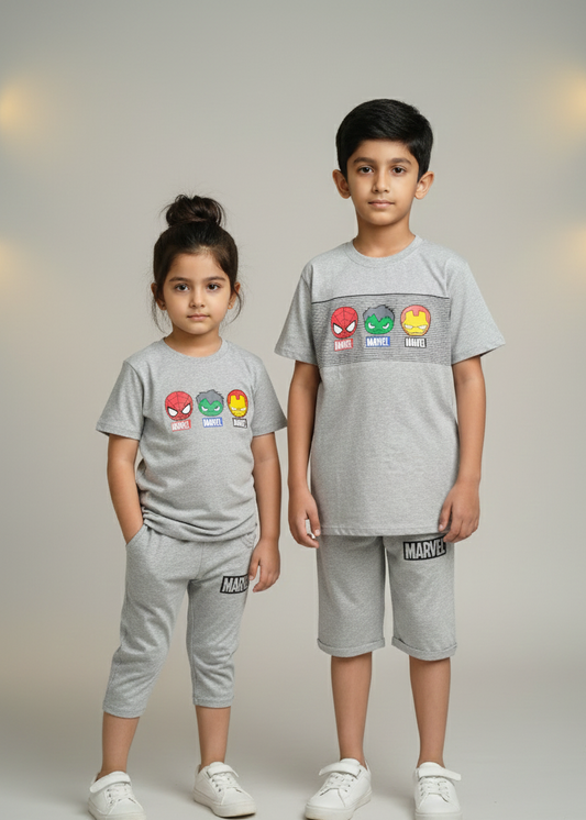 Two children wearing gray Marvel-themed outfits on a plain background
